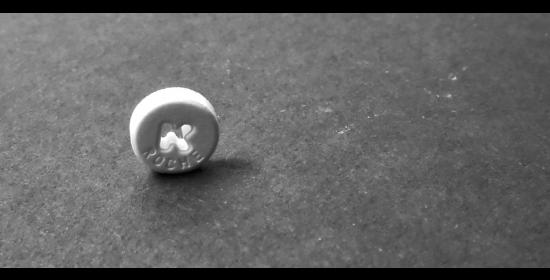 Klonopin pill sitting on a flat surface