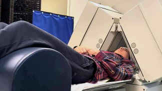 Amen Clinic Spect Test: Here I am undergoing a SPECT image which resulted in a colorful brain imaging showing reduced activity in key regions, evidence of injury from TMS.