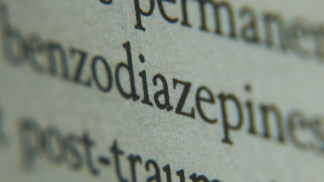 A close up of the typed words benzodiazepines and post-traumatic.